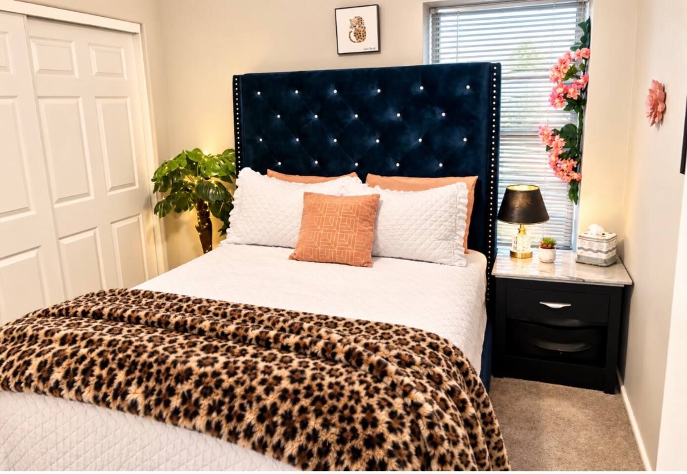 The Velvet Safari Bedroom, with QUEEN size bed and Smart TV. Ceiling fan and palm tree night light. Stadium Oasis Glendale, Az
