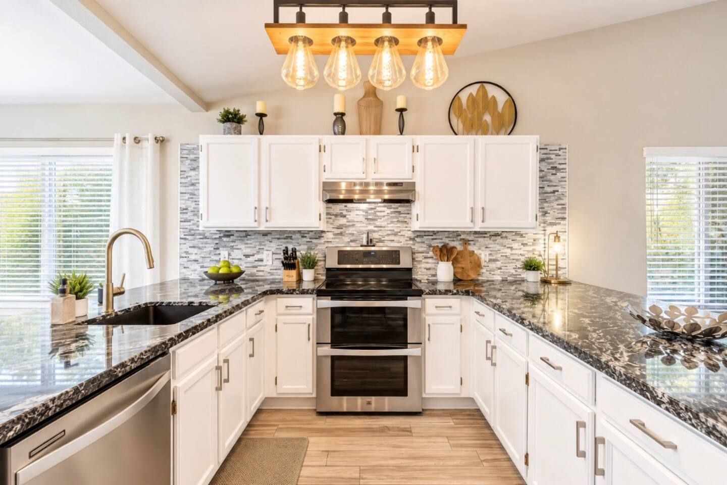 Fully stocked remodeled stylish kitchen with granite counter tops brass accents and new light fixtures. Kenmore Elite Double oven, full size refrigerator, ice maker, dishwasher & garbage disposal. Stadium Oasis Glendale, Az
