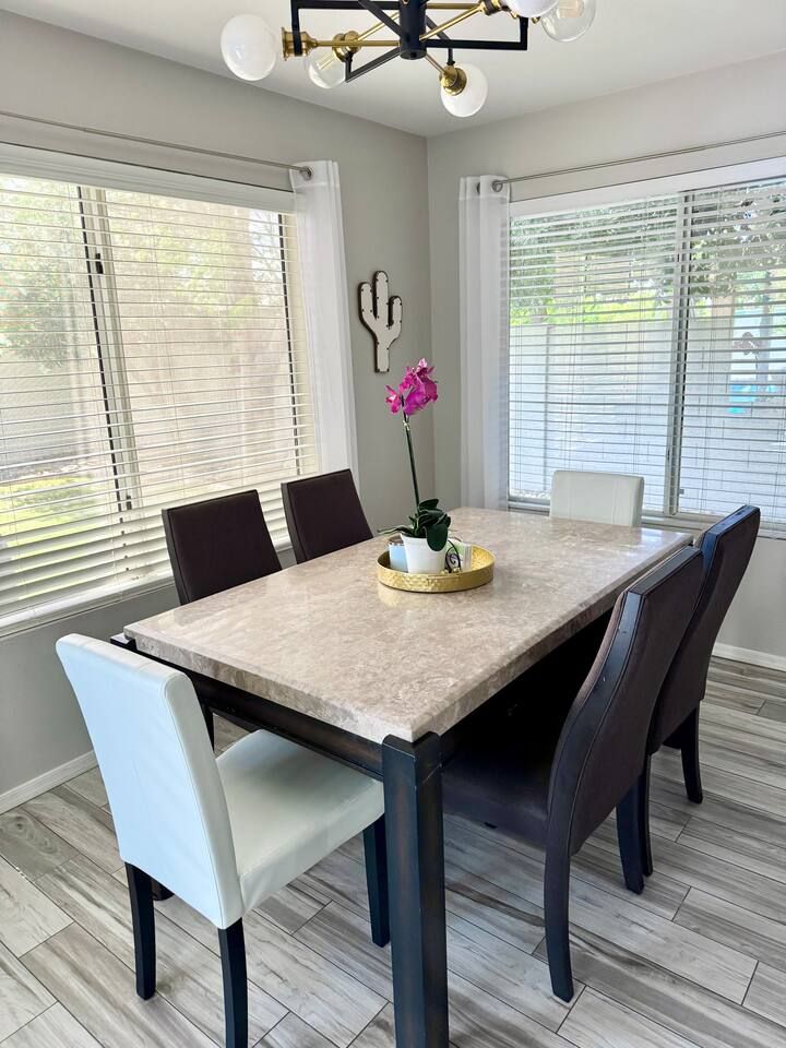 Dining table for 6 opens up into the kitchen. Stadium Oasis Glendale, Az