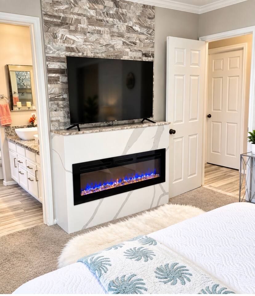 Recently installed romantic electric fireplace with color changing lights. Use for pure ambiance in the summer and extra heat in the winter. Stadium Oasis Glendale, Az