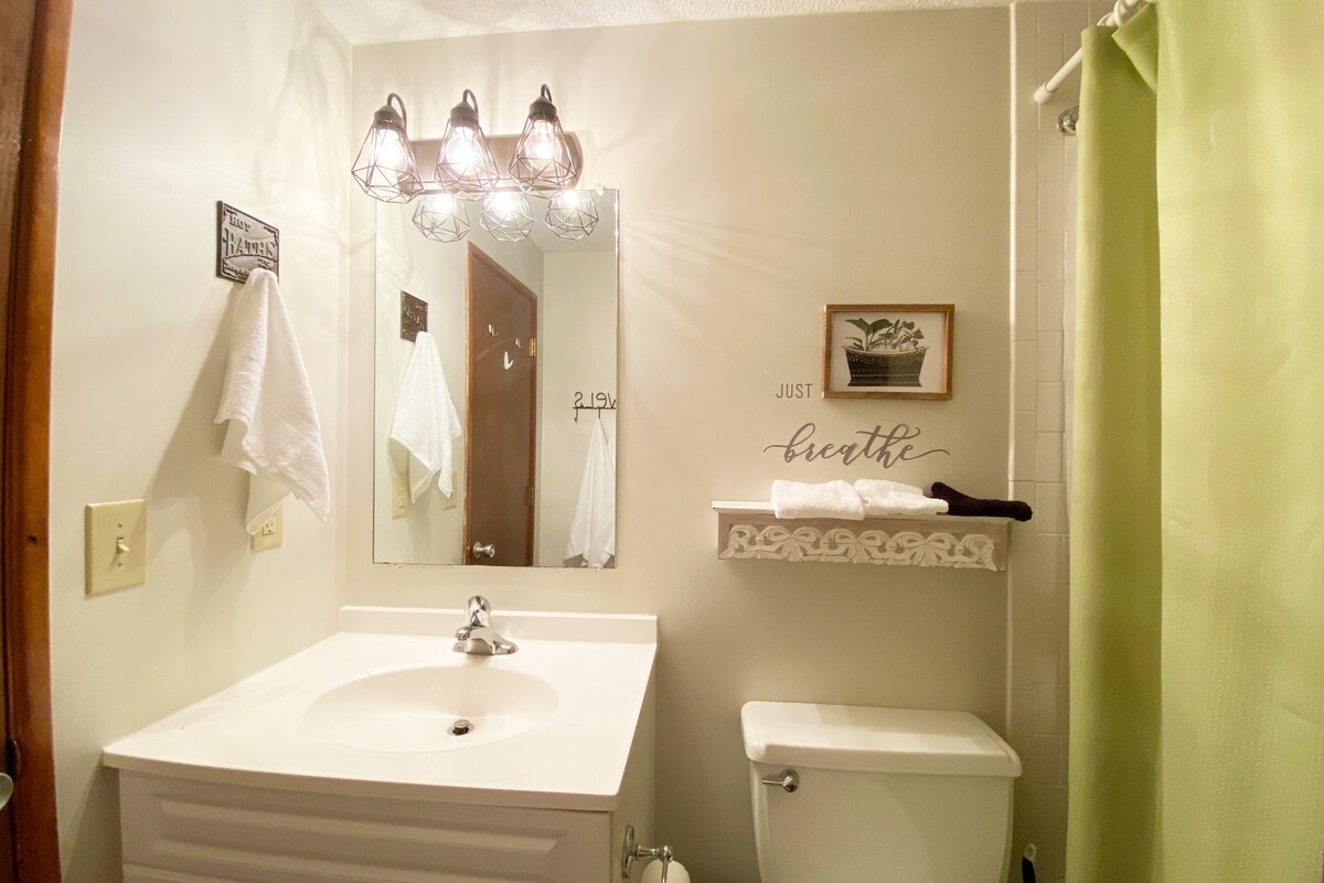 Bathroom serving the Spring themed master bedroom Suite Escape@Snowlake   3-30 NTS | WALK to Lifts