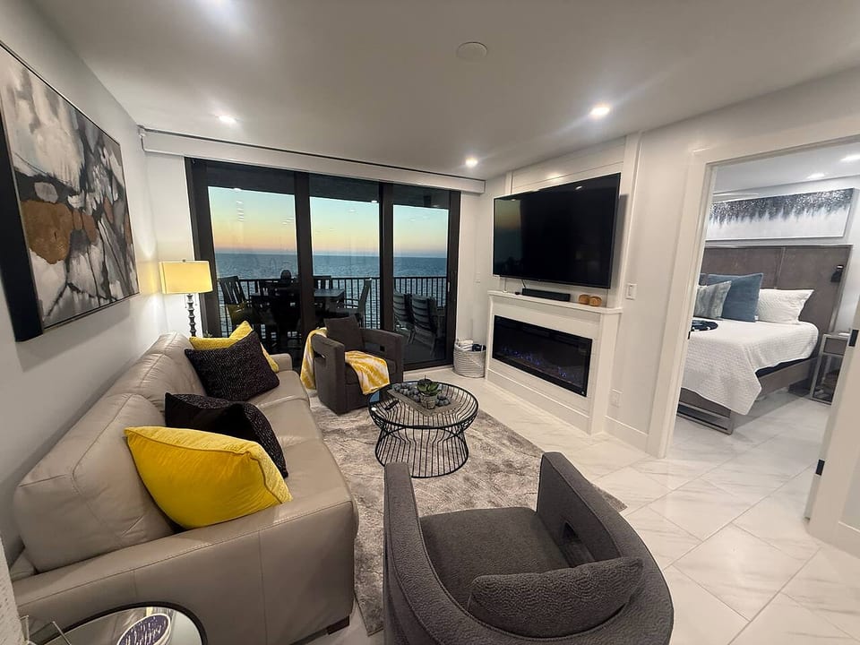 Living room with beautiful sunset view; Additional guests? Recover from the day in our Queen sleeper sofa