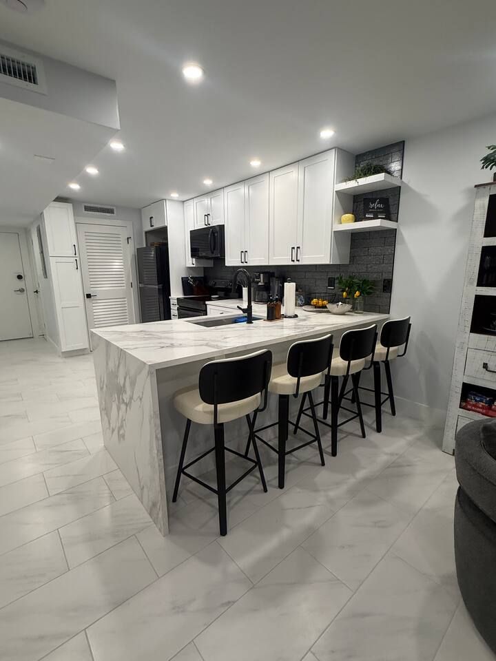 Dining Area and remodeled kitchen with new lighting throughout  Remodeled Aveline | 2 King Bed Ensuites | Sunsets