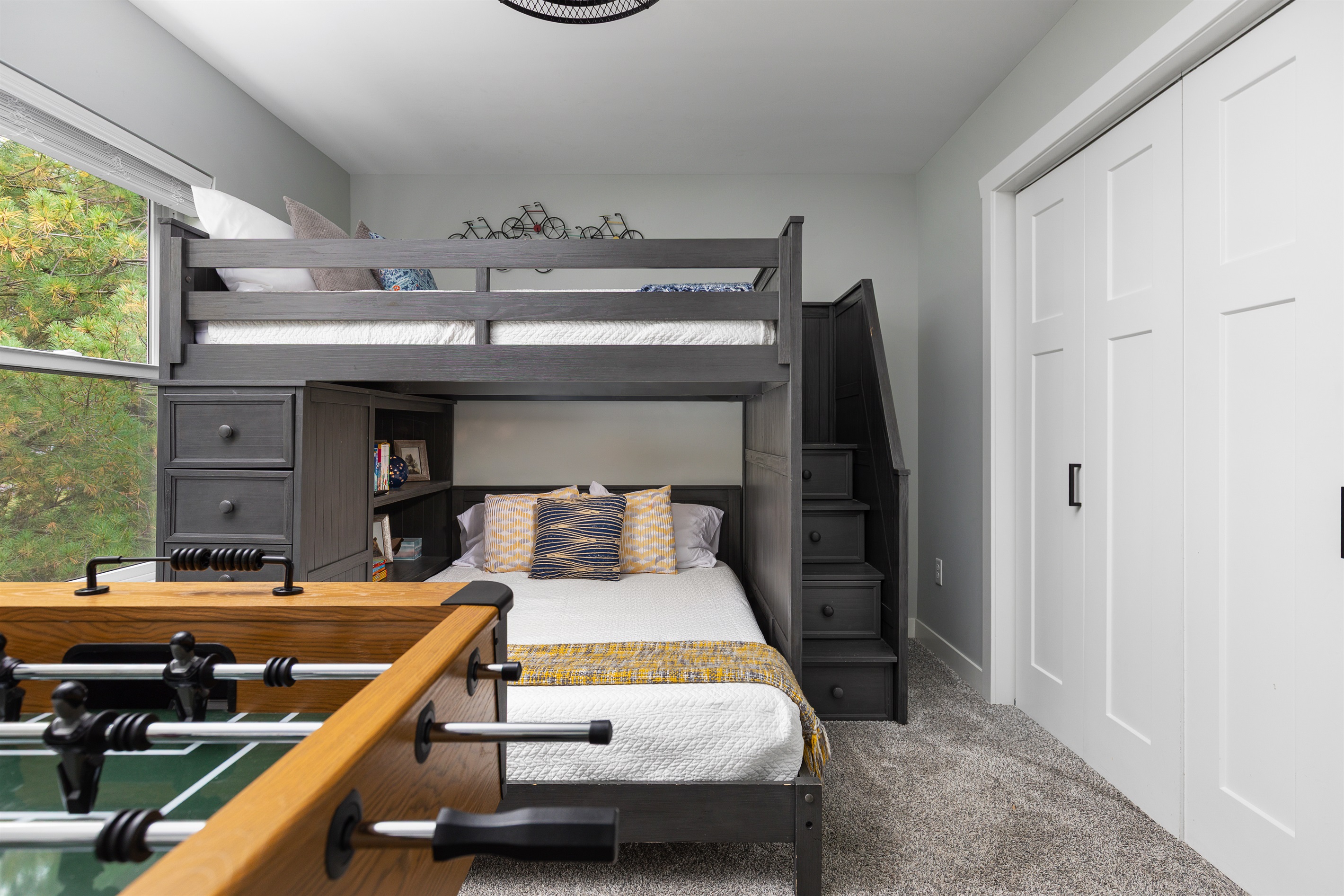 Second bedroom, upstairs with full/full bunk bed, foosball