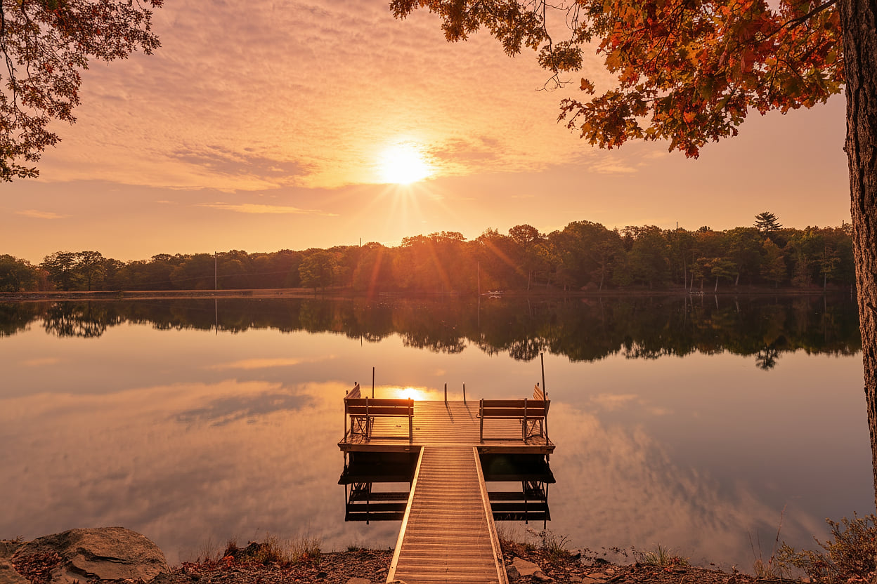 Golden hour hits different here. Calm water, glowing skies, and the kind of lake views that make you forget what day it is.