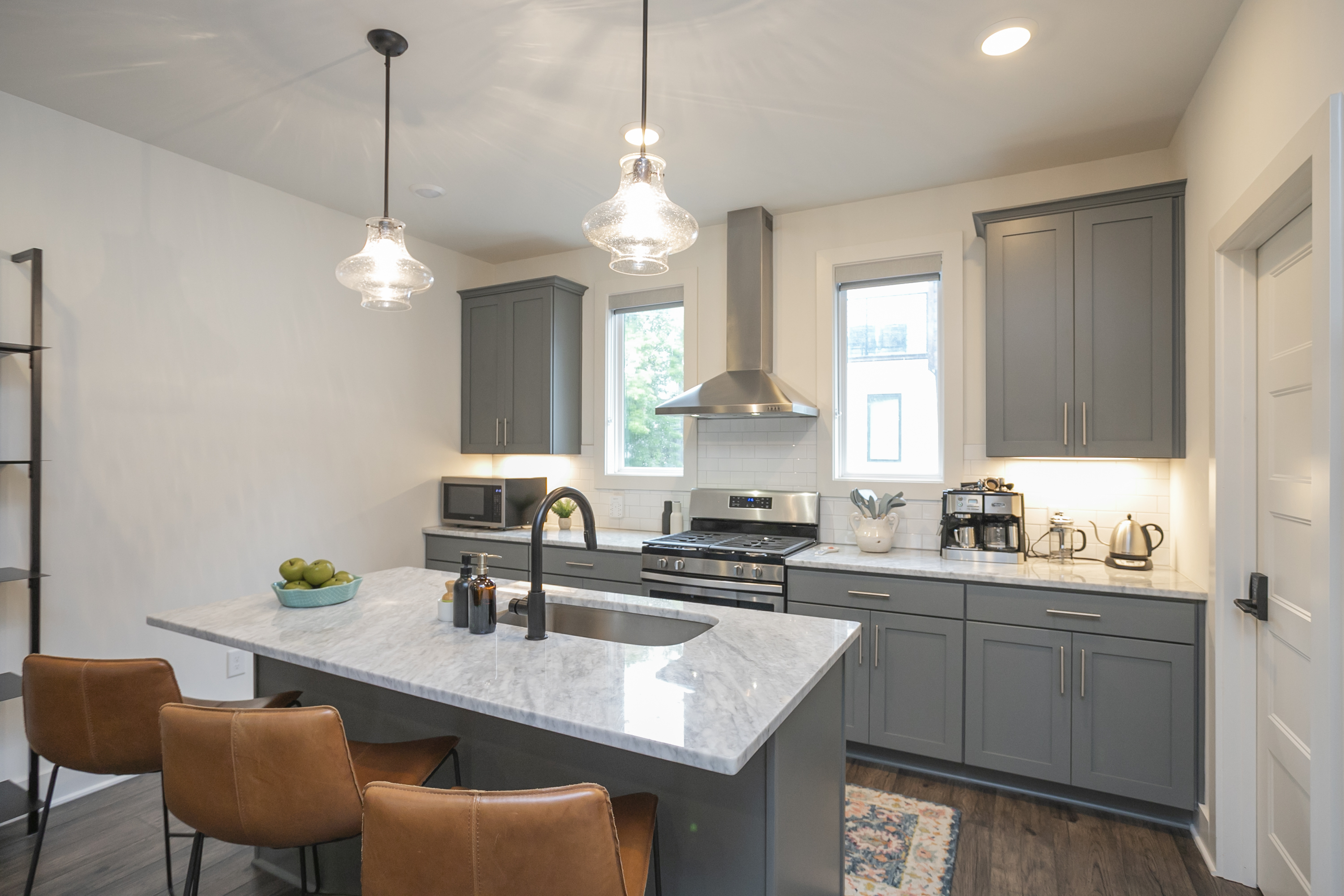 The fully-stocked kitchen has everything you'd need to cook and enjoy meals together. There's a refrigerator, stove/oven, dishwasher, microwave, toaster, cookware, dishes, utensils, drinking g