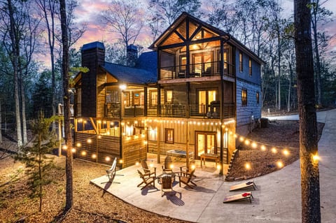 This exclusive home boasts upscale amenities, with outdoor entertainment, in a natural wooded setting