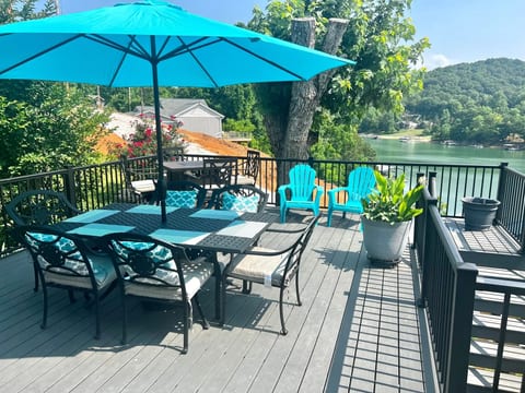 Side of the upper deck has a dining table for 6