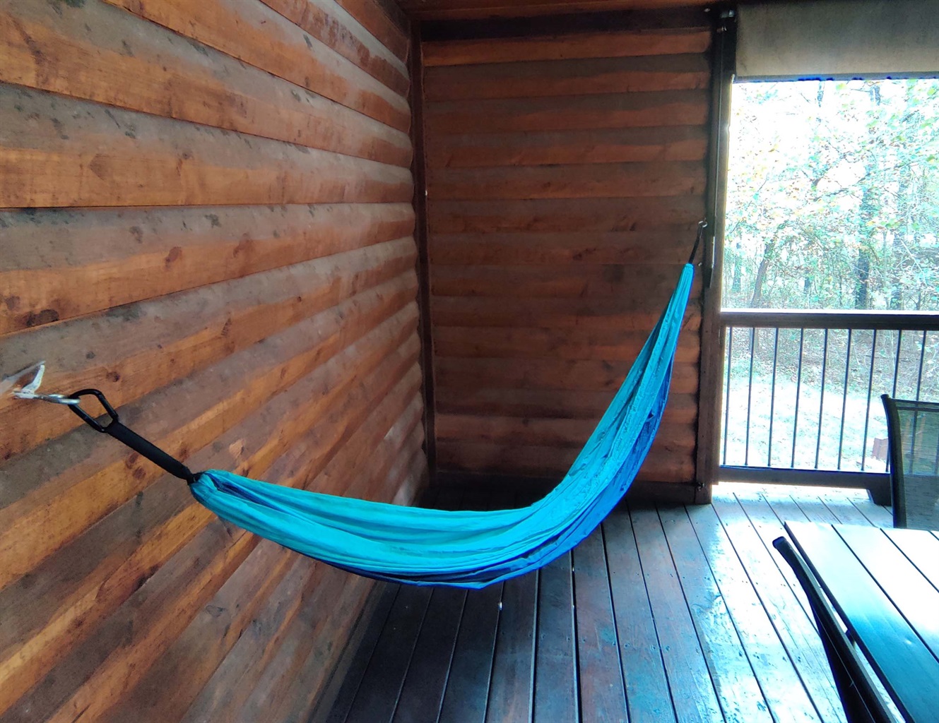 Adults can enjoy relaxing in the hammock right besides the fireplace and dining area #Swing Adults can enjoy relaxing in the hammock right besides the fireplace and dining area #Swing - Iron Horse Lodge - Broken Bow