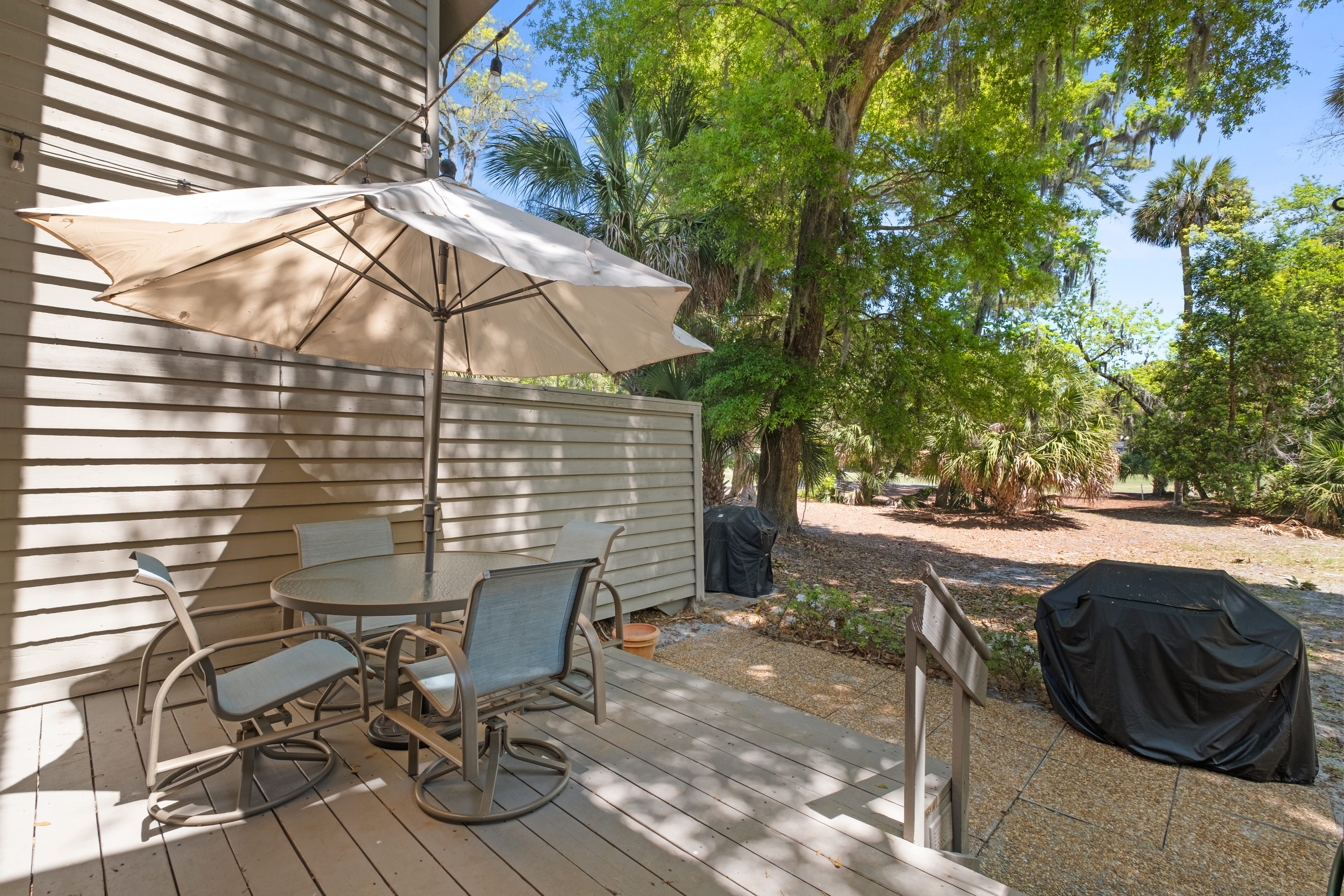 Backyard deck with gas grill. On 6th hole fairway of Galleon Golf Course