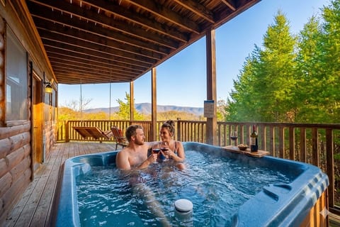 Unwind in the bubbling hot tub as you take in the peaceful mountain views, the perfect spot to relax, recharge, and breathe in the crisp air