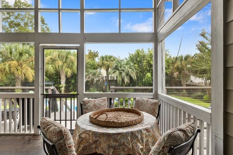 Screened Porch overlooks Pool and Yard