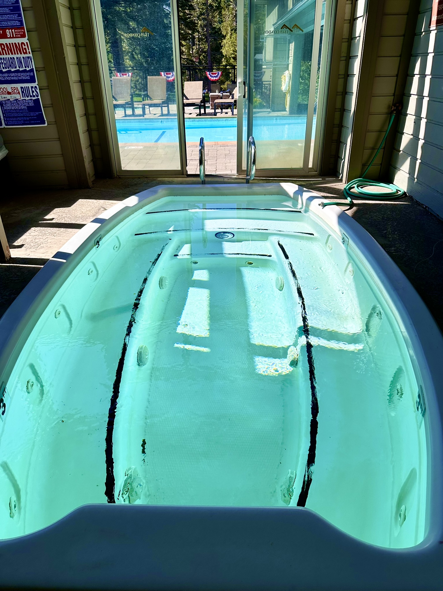 Pool area with 2 outdoor year round heated jacuzzis and this indoor