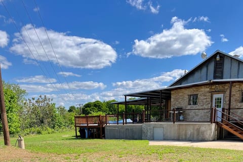 Back view of the Stonewall Mill House with porch and deck.