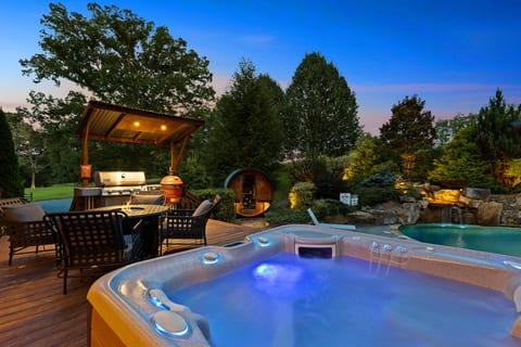 Sink into the hot tub with the grill, fire table, and sauna steps away.
