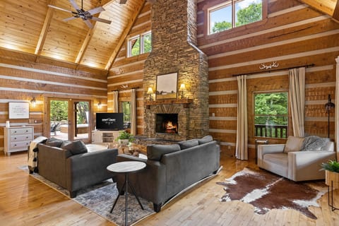 Settle in by the stone fireplace under the vaulted great room ceiling.