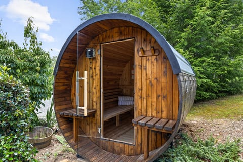 Heat up in the barrel sauna, then cool off under the open sky.