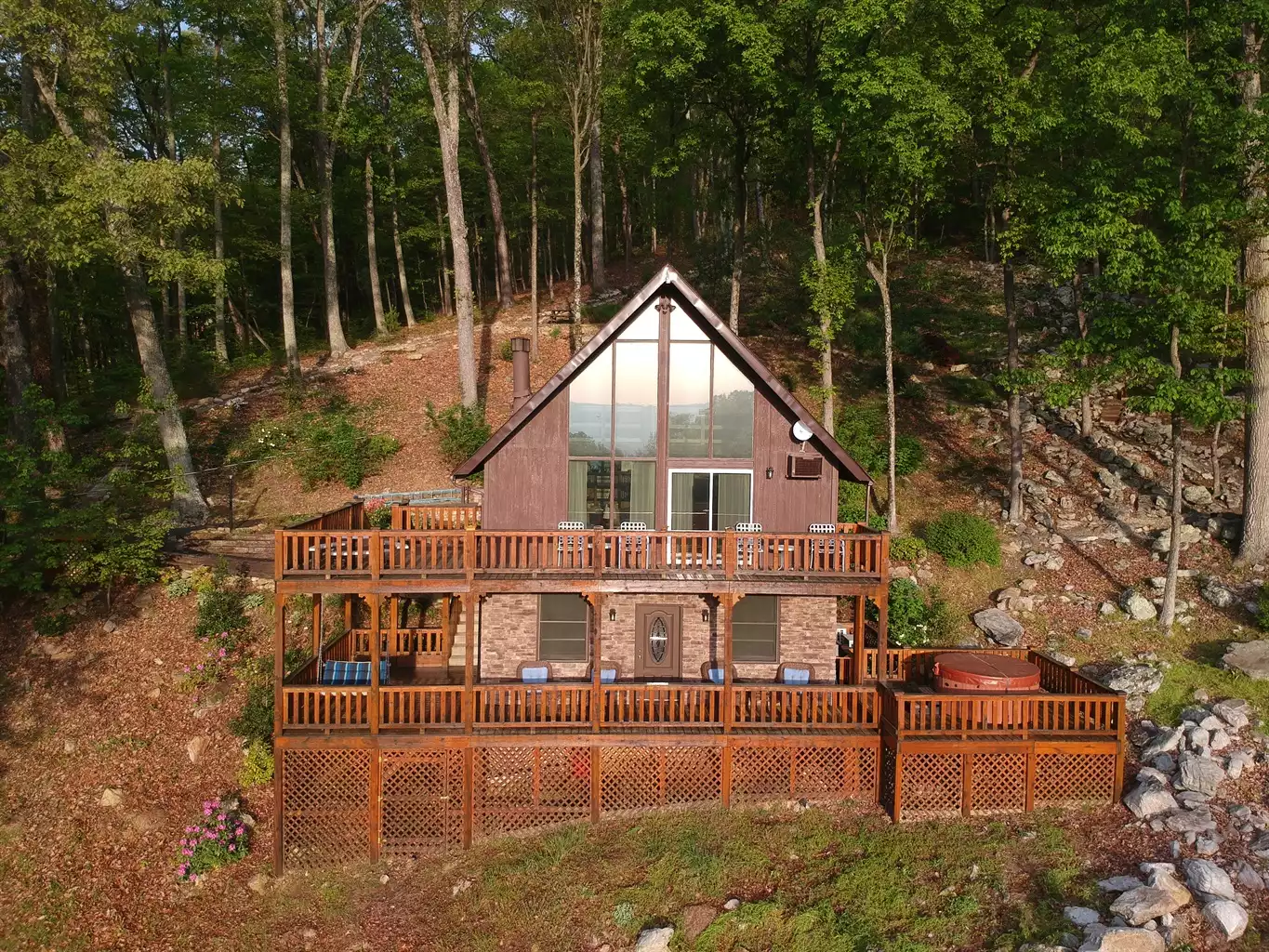 Late Spring drone photograph of Shenandoah Solitude at Roads End with rhododendrons and other flowering shrubs blooming - Shenandoah Solitude - Luray