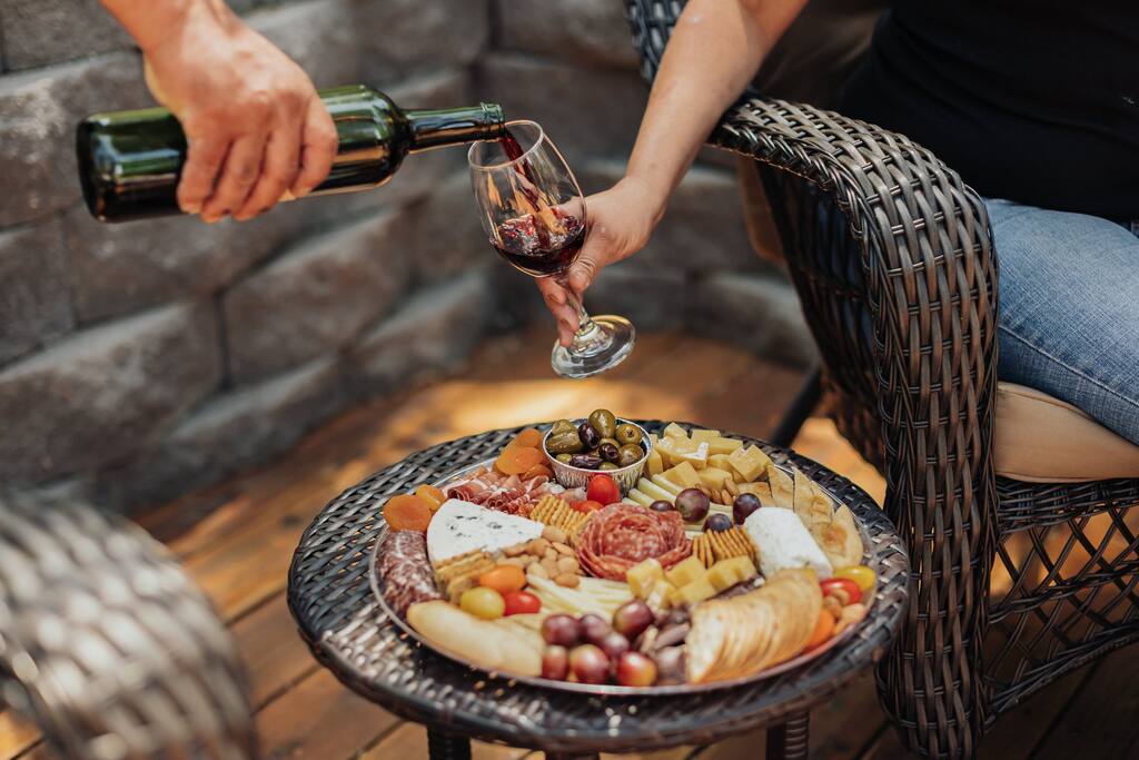 A cozy sitting area to soak in the sun surrounded by tranquil nature sounds and amazing views! Ask us how you can order your own charcuterie board and have it delivered to our cabin during your stay.