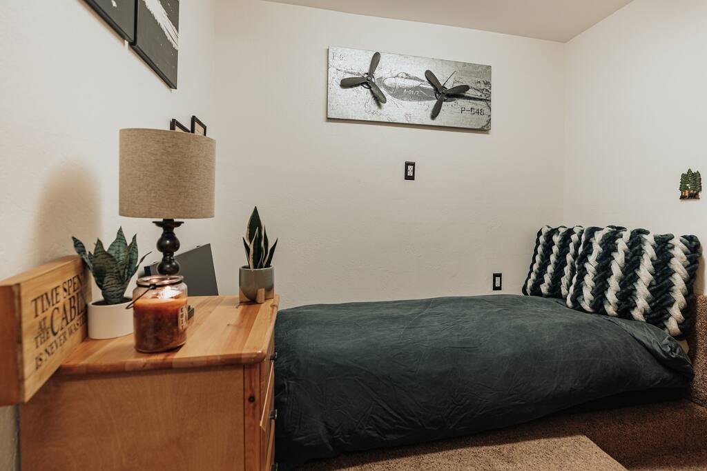 The cabin’s office converts to a small sleeping space. It's the perfect place to relax or perfect for a quick nap.