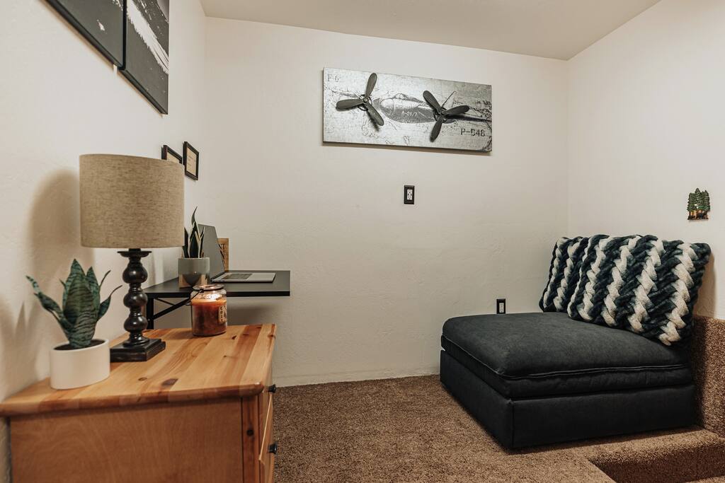 Our cabin’s office space is complete with a fold down desk, and a comfy chair that converts to a small single bed.