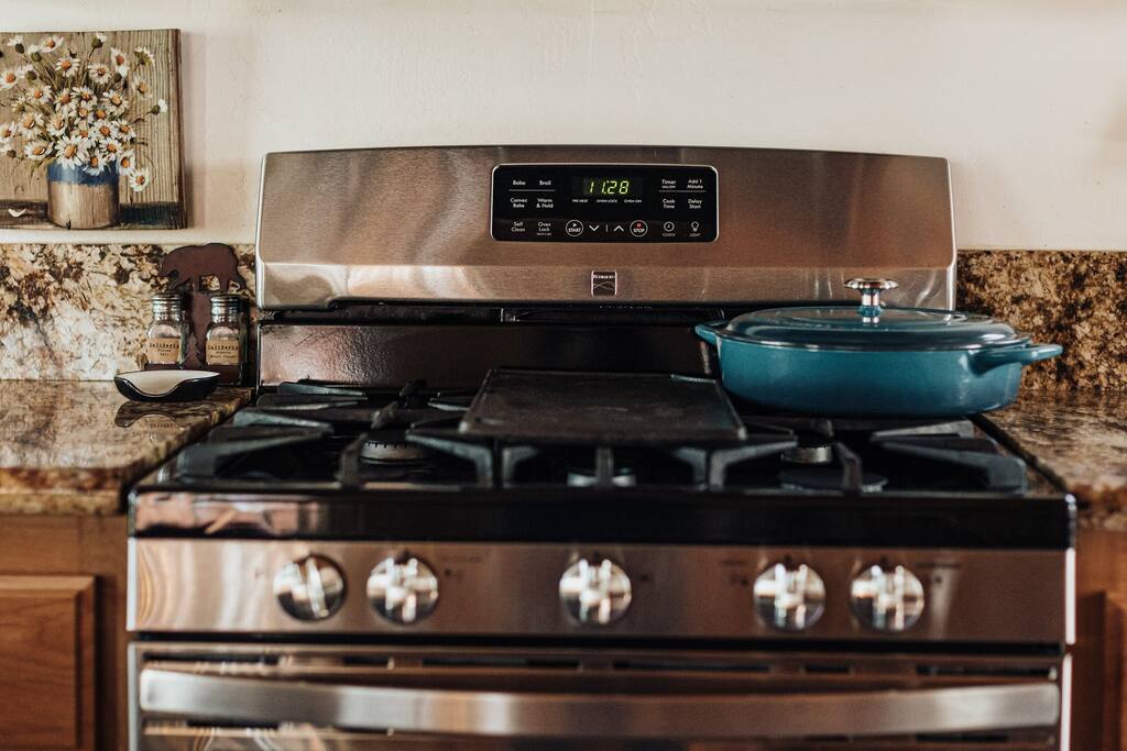 Cook for yourself or your guests in our fully stocked cabin’s kitchen. It feels like you are in a compact chef's kitchen.