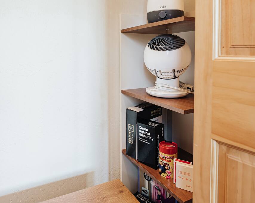 The main bedroom has a Smart TV, extra pillows, handheld garment steamer and adult versions of games.