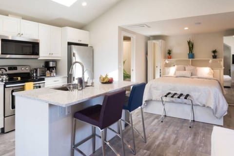 Full kitchen with standard size appliances, including a refrigerator/freezer, stovetop range, microwave, dishwasher, coffeemaker, toaster, and state of the art Multi-Pure water filtration system