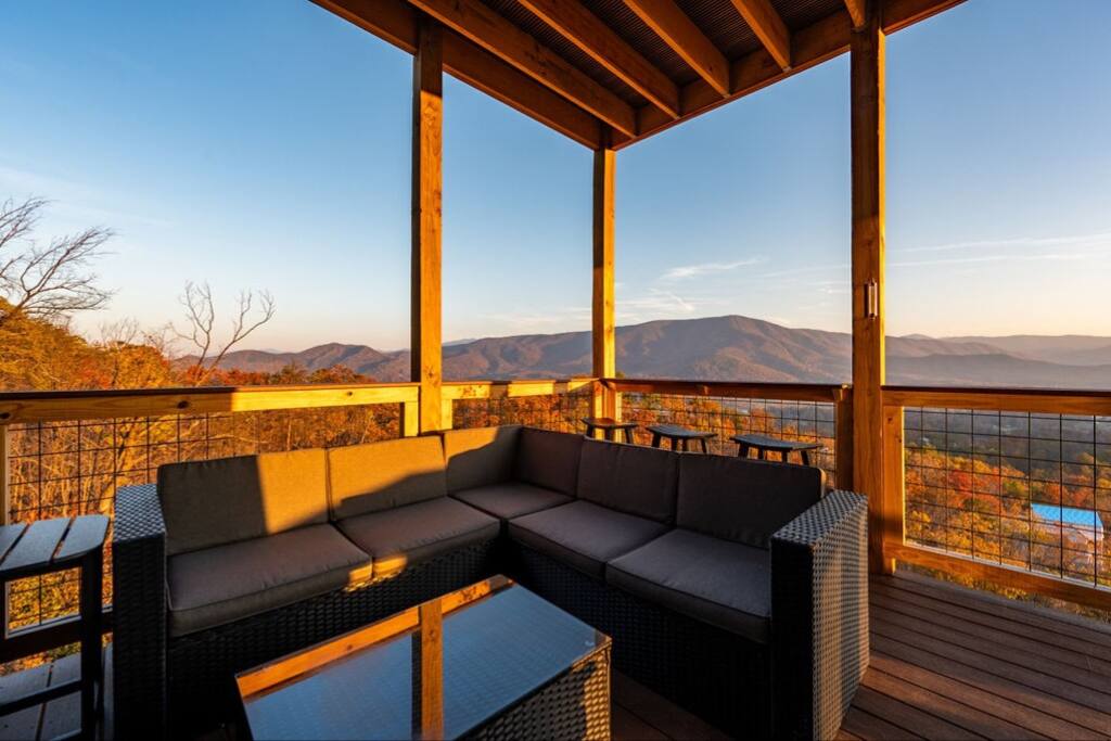 Sectional seating and Cocktail Railing with bar stools facing the view