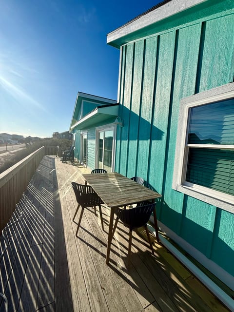Spacious front deck with a partial ocean view
