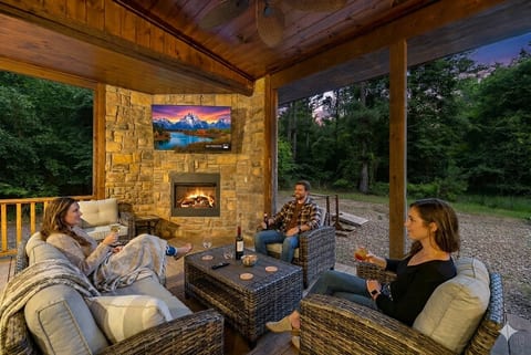 Savor the warmth of the fire and the company of loved ones as you unwind with a glass of wine by the outdoor fireplace.