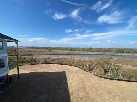 View from the 2nd story deck that takes in the expansive view of Waters Bay and the evening sunset.