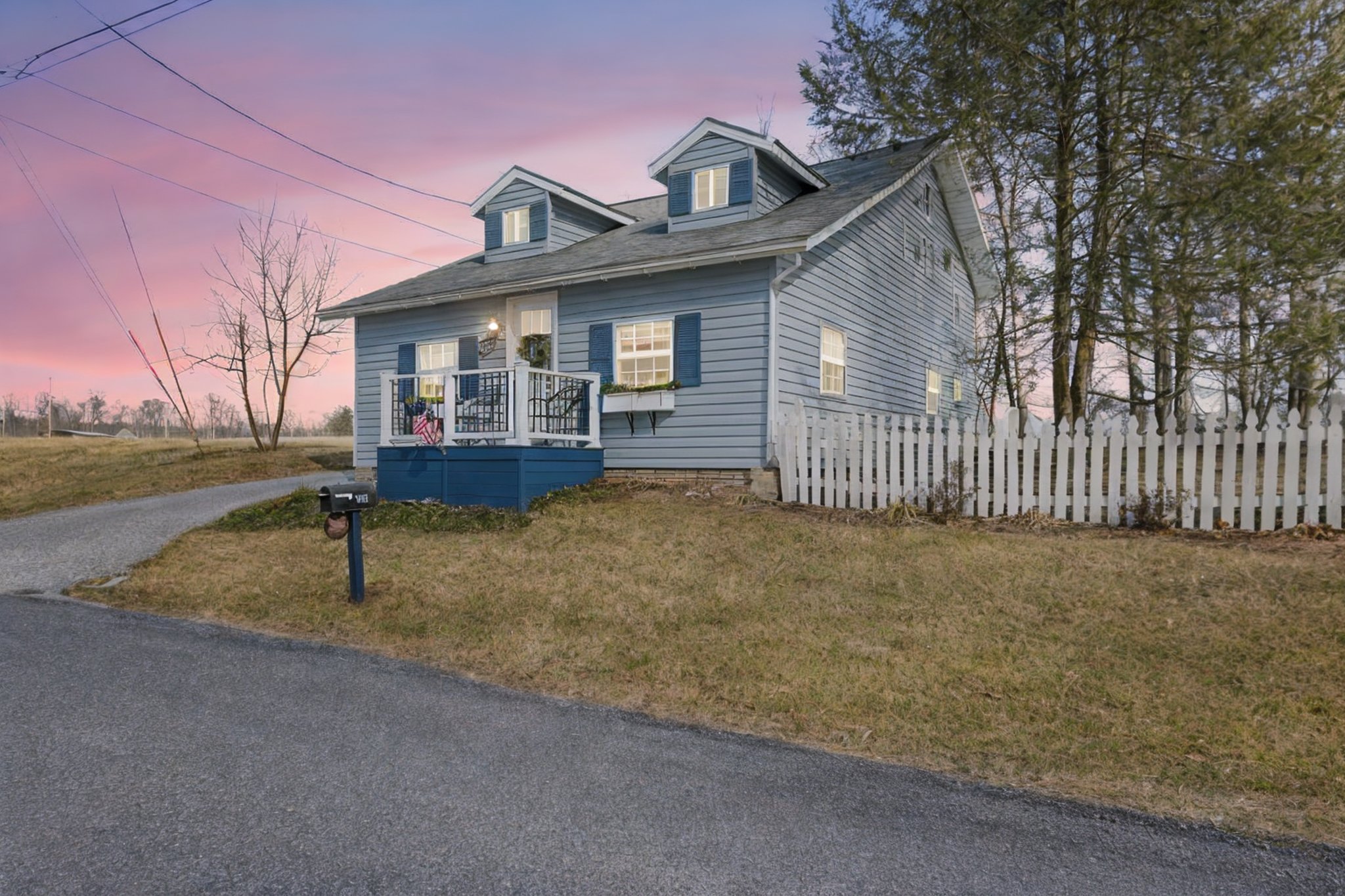 Blue Coat Cottage surrounded by peaceful farm fields.