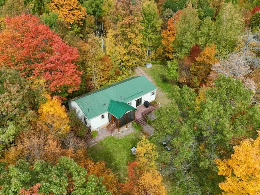 Fall foliage!! Picture taken on 10/5/2022. Come explore incredible up-north adventures with your friends / family at the Cozy Bear Cabin! Waterfront cabin located deep in the Barron Count Forest offers wonderful privacy + lake access!