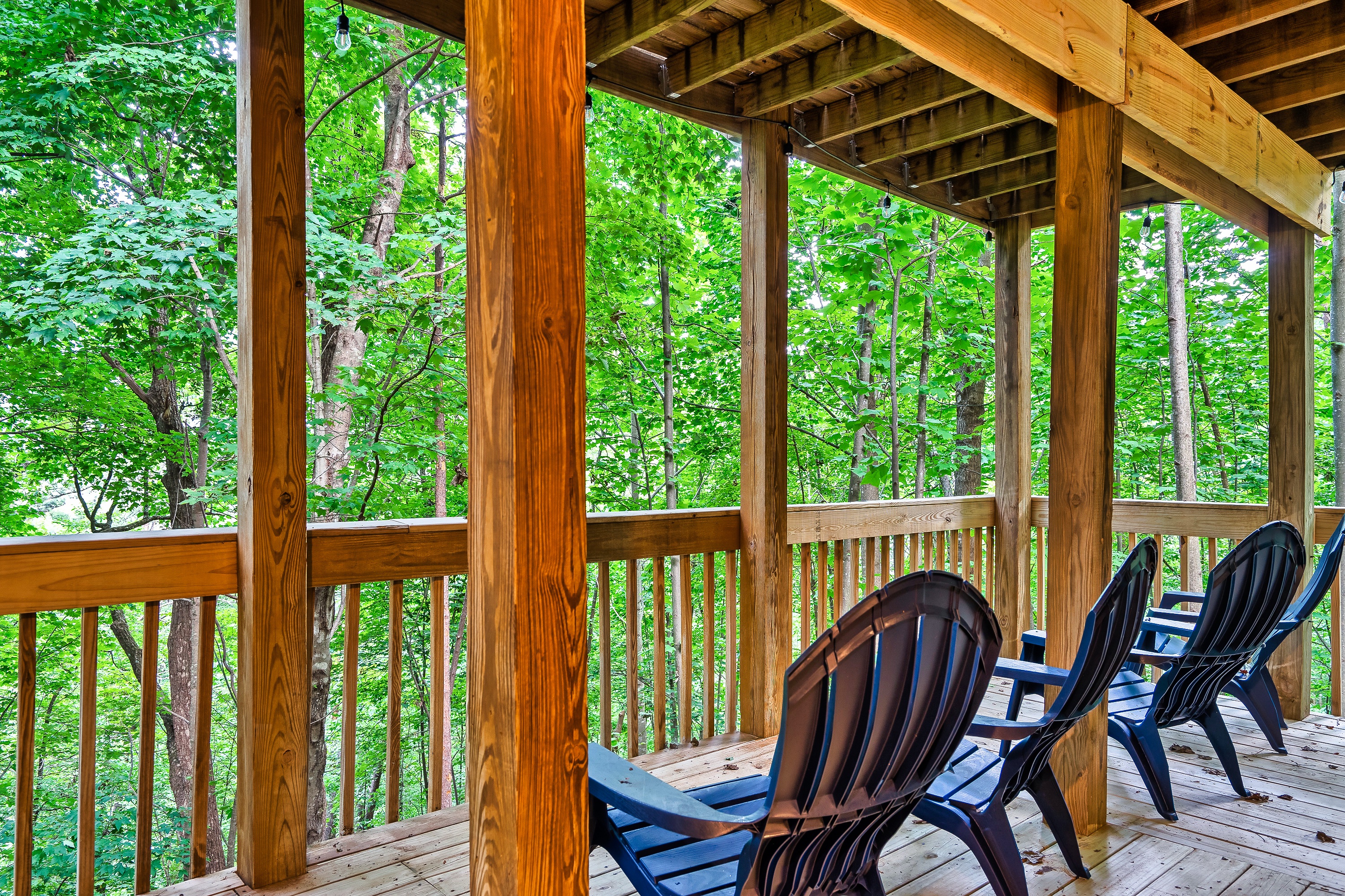 Main level deck welcomes any guests to sit back and relax a cup of coffee while listening to the birds chirp