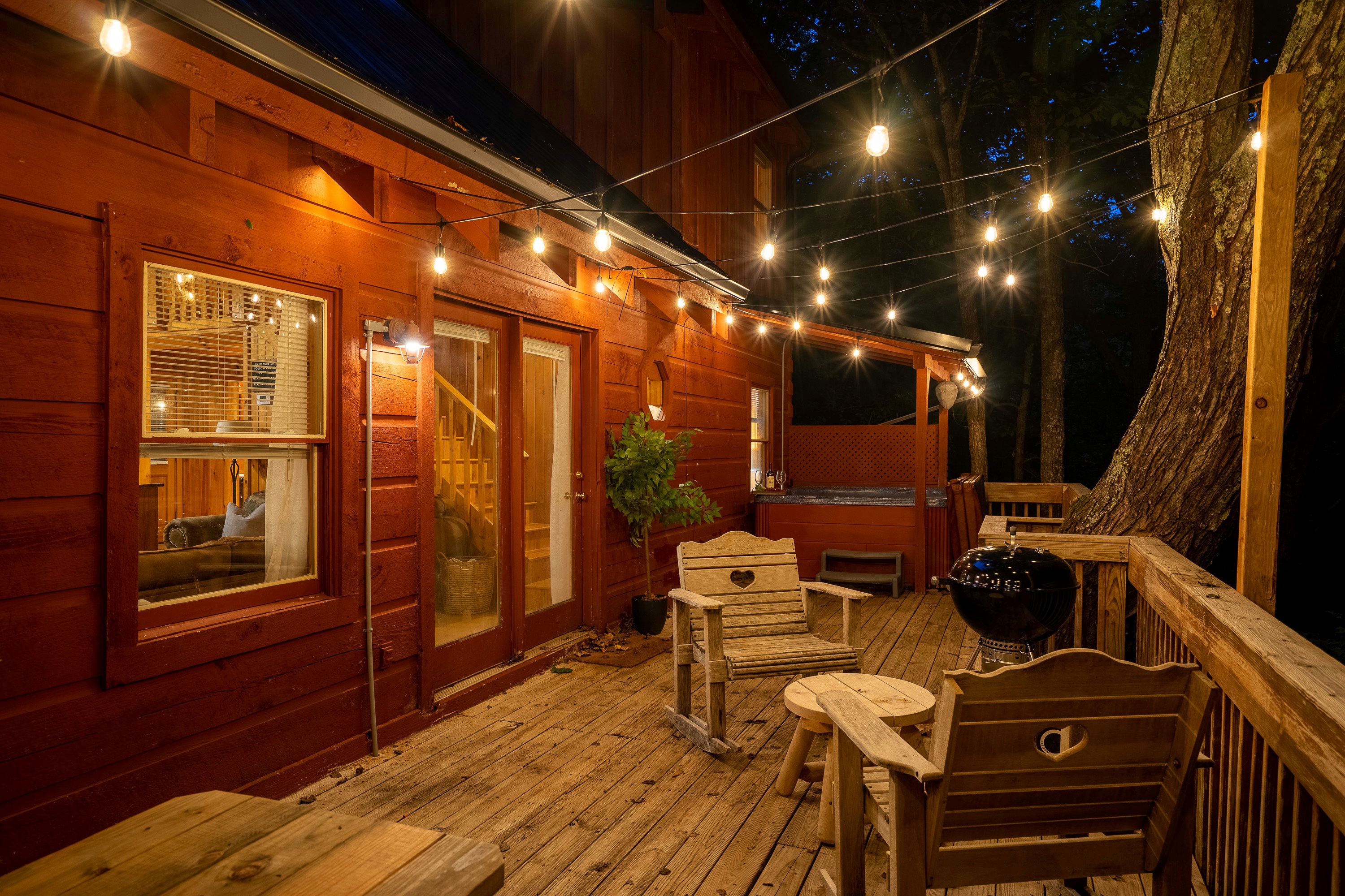 Cozy under the fairy lights in the hot tub or relax and take in the sounds of nature on this wraparound deck