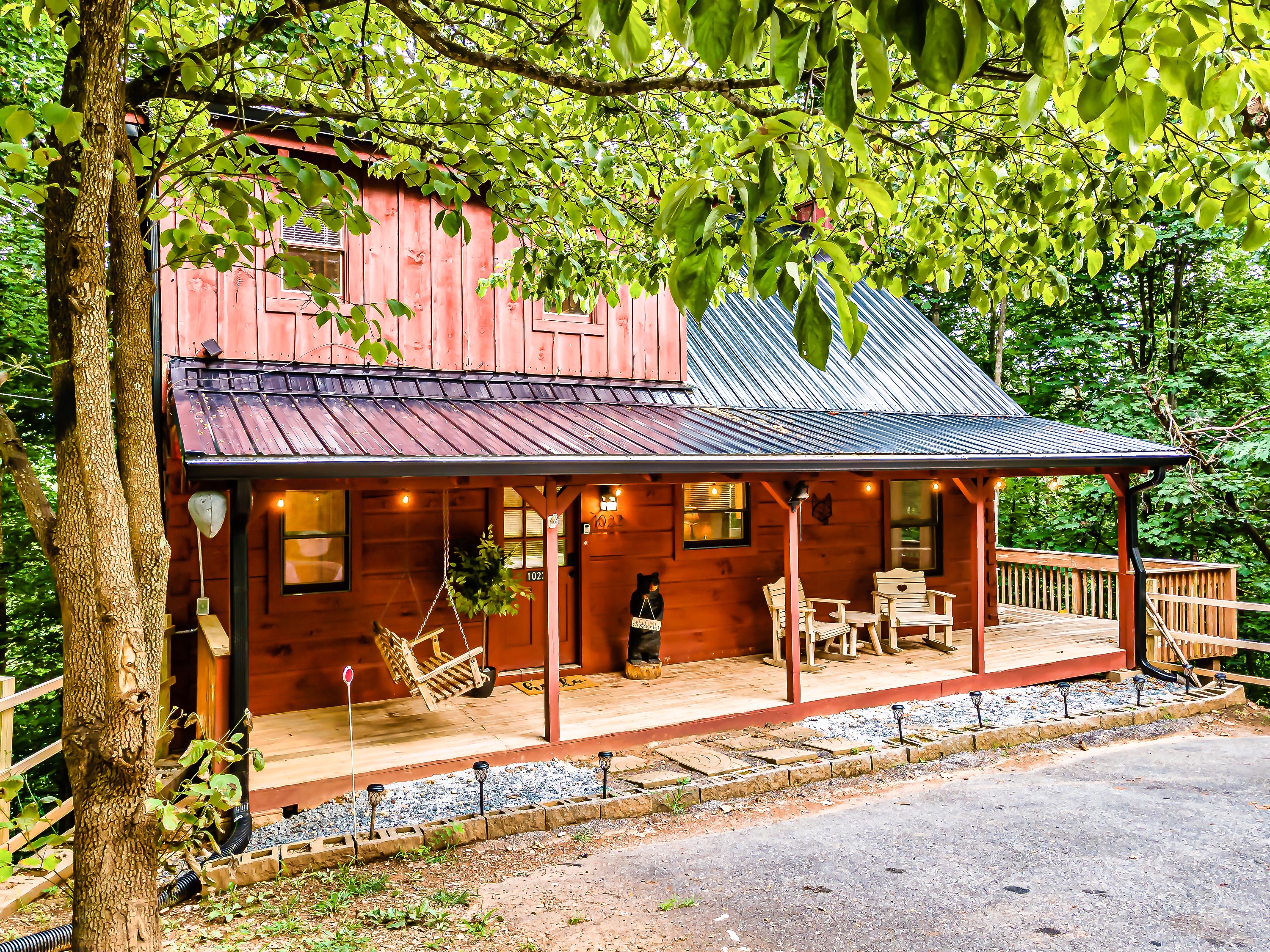 Charming and inviting front porch welcomes all of our guests for a relaxing stay