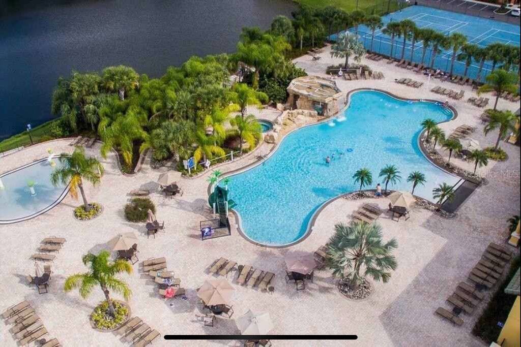 Community pool with beach entry,slide and kiddie area