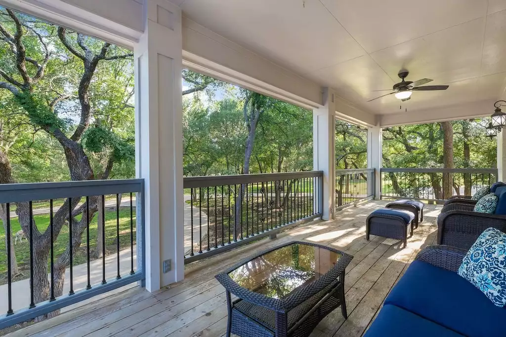 Large upstairs balcony gives the illusion that you are hidden in the trees. - Main House at Whispering Oaks Estate - Dripping Springs