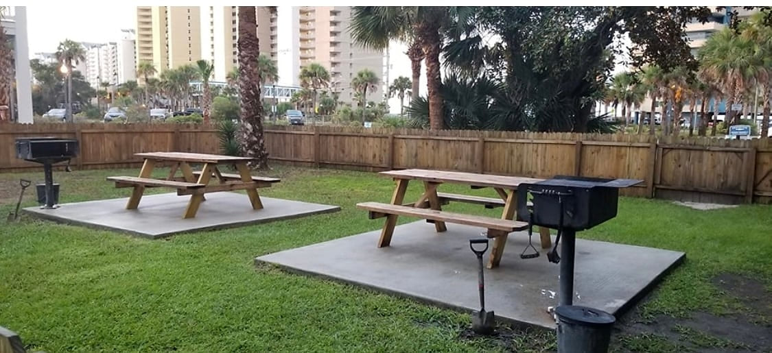 Picnic tables and charcoal grills