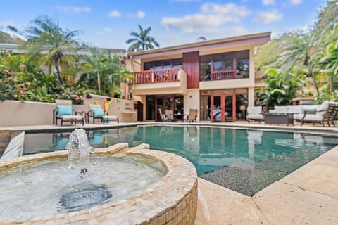 The patio is made for fun -- jetted infinity-edge pool with fountain, sun lounges, dining, deeply cushioned conversation seating, pool toys and a large grill!