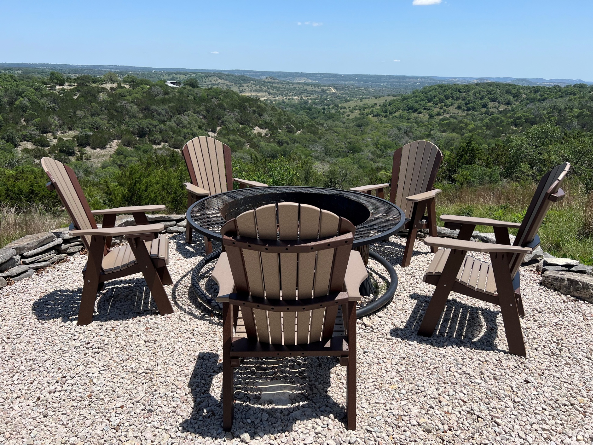 New polywood chairs around the fire pit area