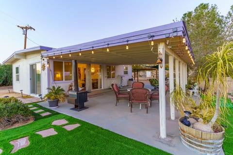This charming patio is fully furnished with outdoor table and chair