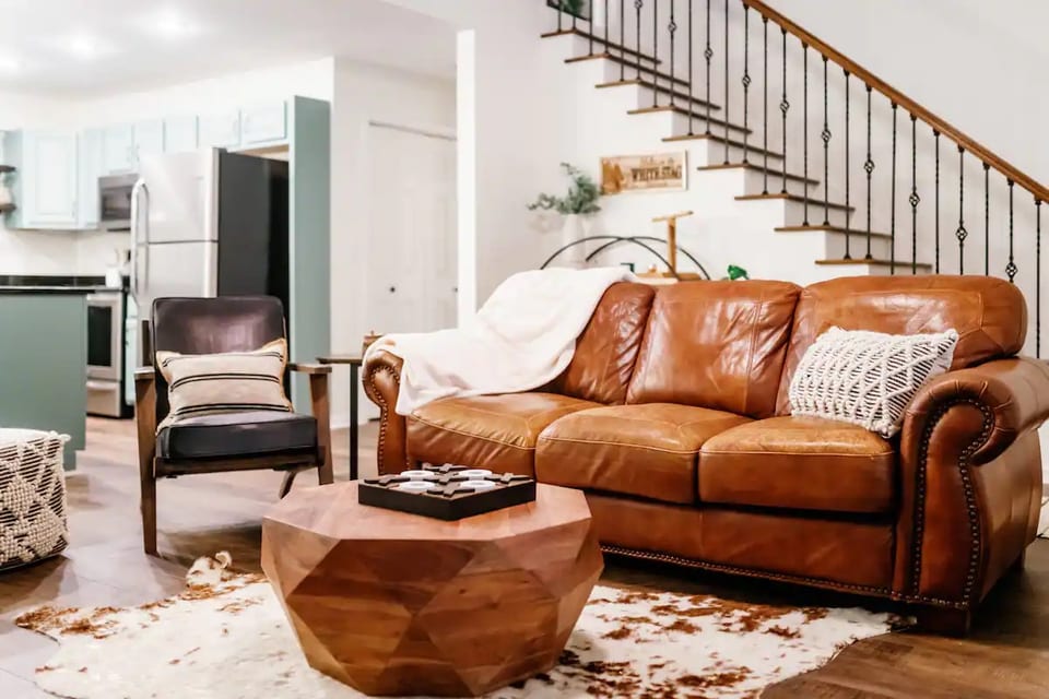Cozy up on our vintage sofa to enjoy a nap or a good book, or snuggle up with your favorite person and watch the fire glow.