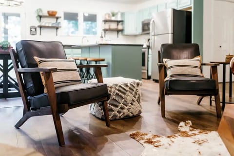 Put your feet up and relax in our mid century leather chairs. The ottoman can be used as a side table, foot stool, or extra seating.