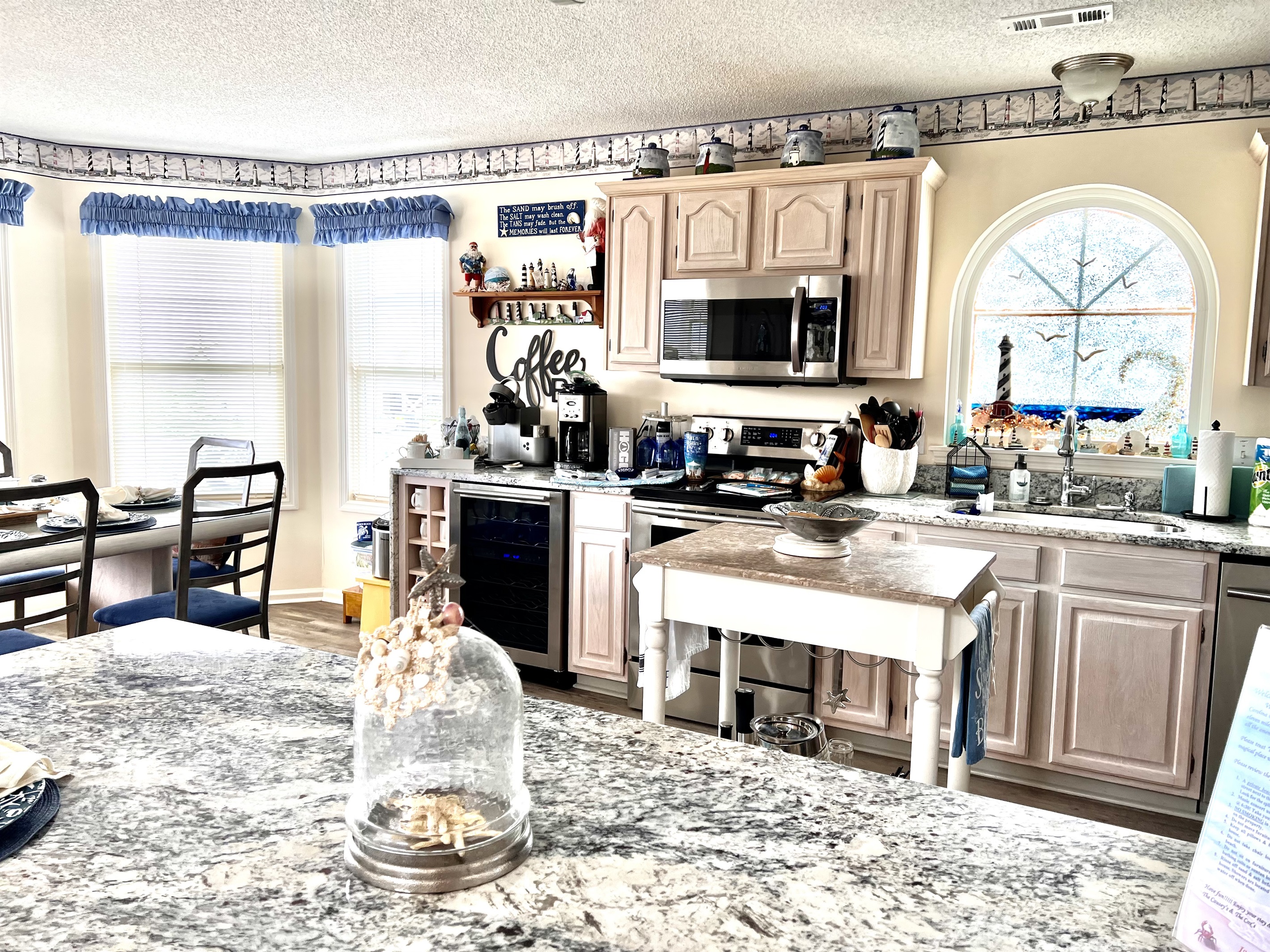 Kitchen with custom stain glass windows & coffee bar Kitchen with custom stain glass windows & coffee bar - The C's By The Sea - Holden Beach