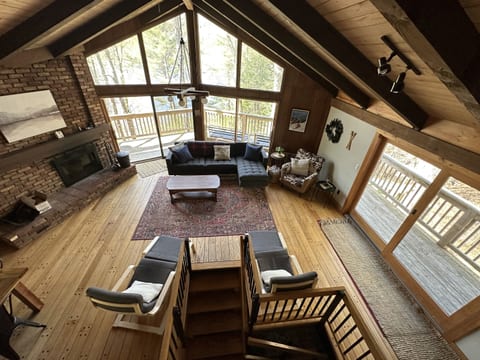 Plenty of space to relax and get cozy with wood burning fireplace, couch, recliners and blankets.