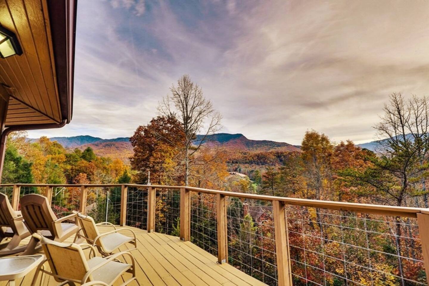Standing on the expansive deck of this mountain retreat is a breathtaking experience that words can scarcely capture. As the sun dips below the horizon, the world transforms into a masterpiece of nature's finest artistry.
