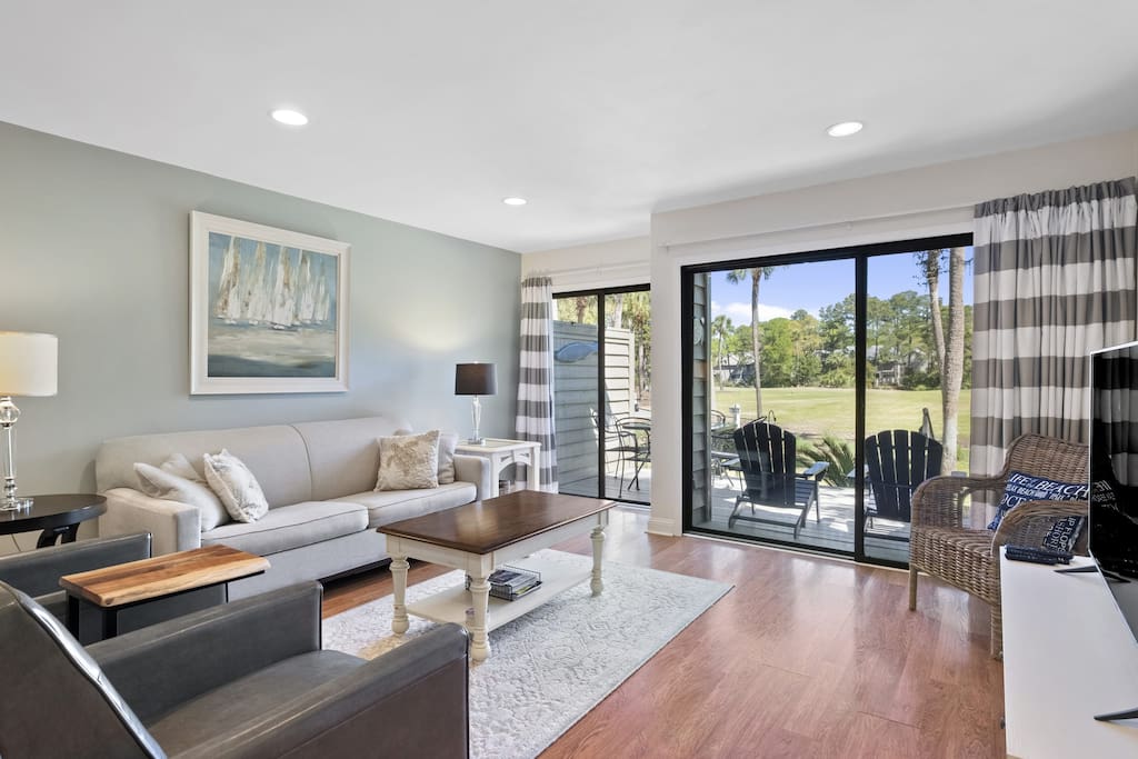 Spacious living room with view of 6th hole Galleon golf course.