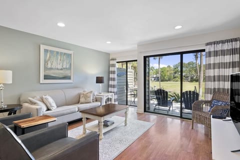 Spacious living room with view of 6th hole Galleon golf course.